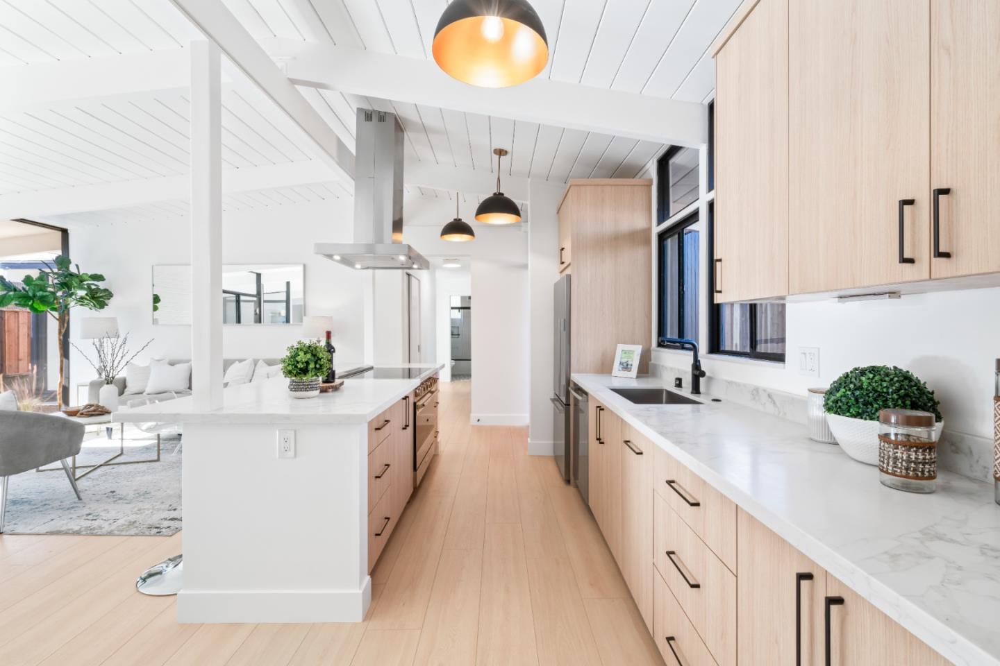 1714 Celeste Drive San Mateo, CA 94402 - Photo 10 of 45 a large kitchen with kitchen island white cabinets and wooden floors