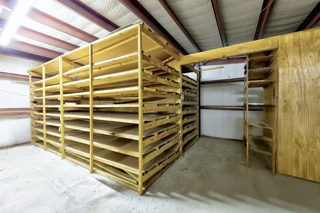 an aerial view of a house with garden space and street view