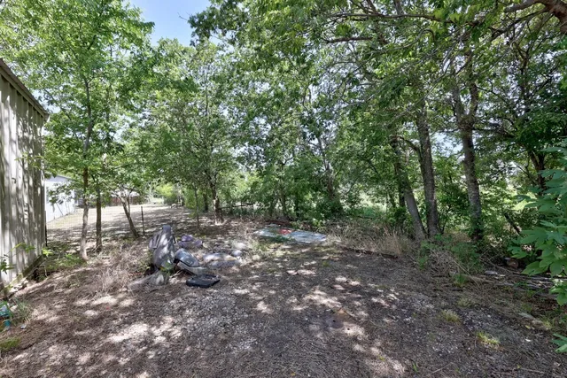 a backyard of a house with lots of green space