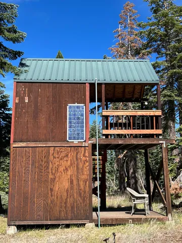 a view of balcony with wooden floor and outdoor seating