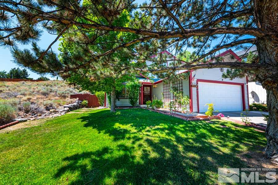 3930 Aspendale Drive Reno, NV 89503 - Photo 5 of 26 a front view of a house with swing and a tree