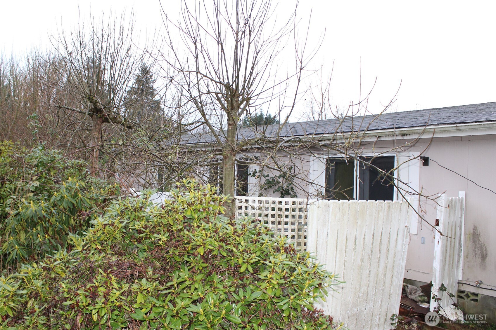 416 Main Street Vader, WA 98593 - Photo 2 of 22 a house with trees in front of it