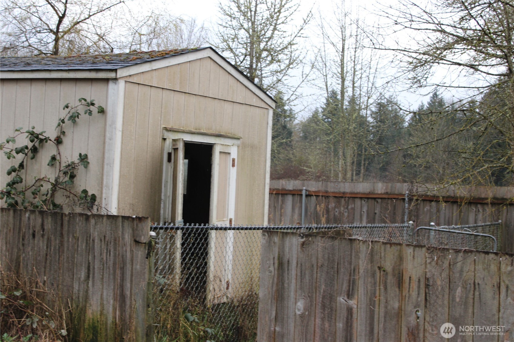 416 Main Street Vader, WA 98593 - Photo 5 of 22 a view of a balcony with wooden fence and floor