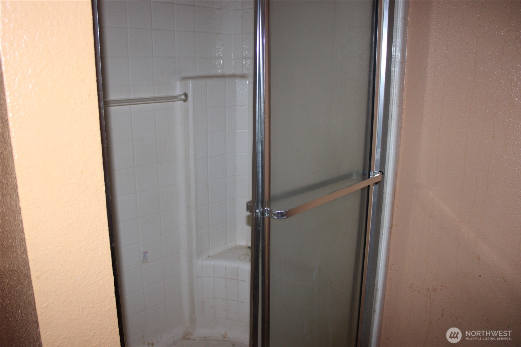 416 Main Street Vader, WA 98593 - Photo 9 of 22 a bathroom with a glass shower door
