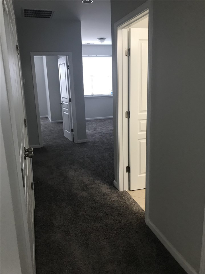9165 Wooden Road Raleigh, NC 27617 - Photo 19 of 20 Upstairs Hallway