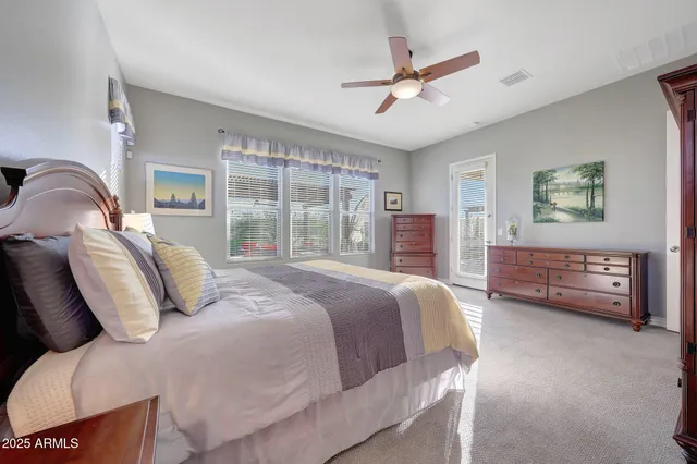 a spacious bathroom with a double vanity sink and a mirror