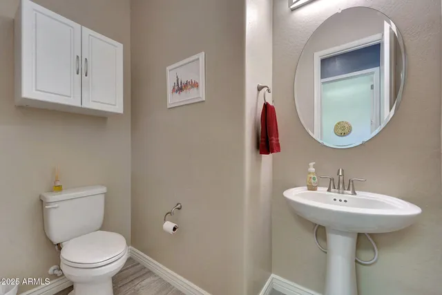 a view of a storage and utility room with washer and dryer