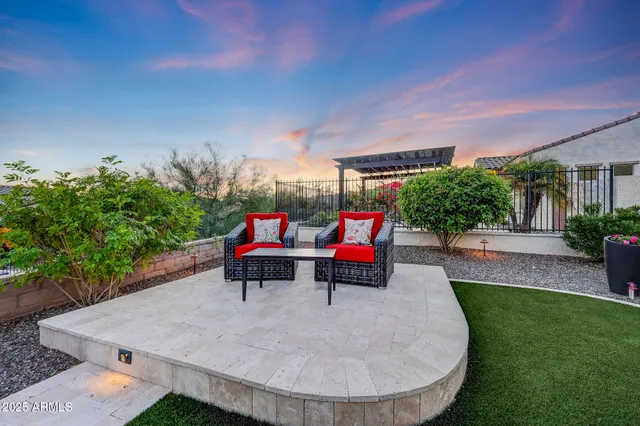 a view of a backyard with plants and a patio