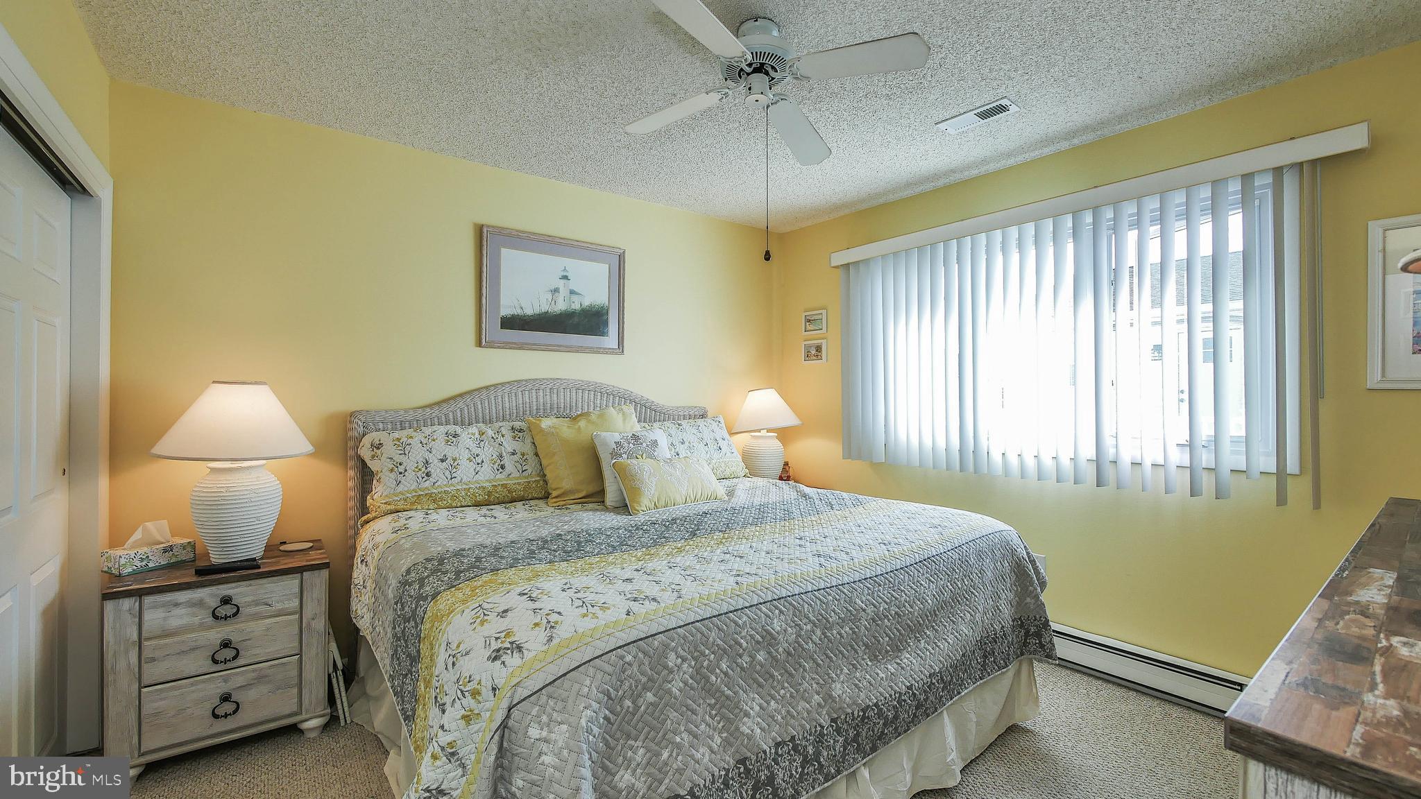 4025 4th Avenue Avalon, NJ 08202 - Photo 16 of 32 a bedroom with a bed and a window