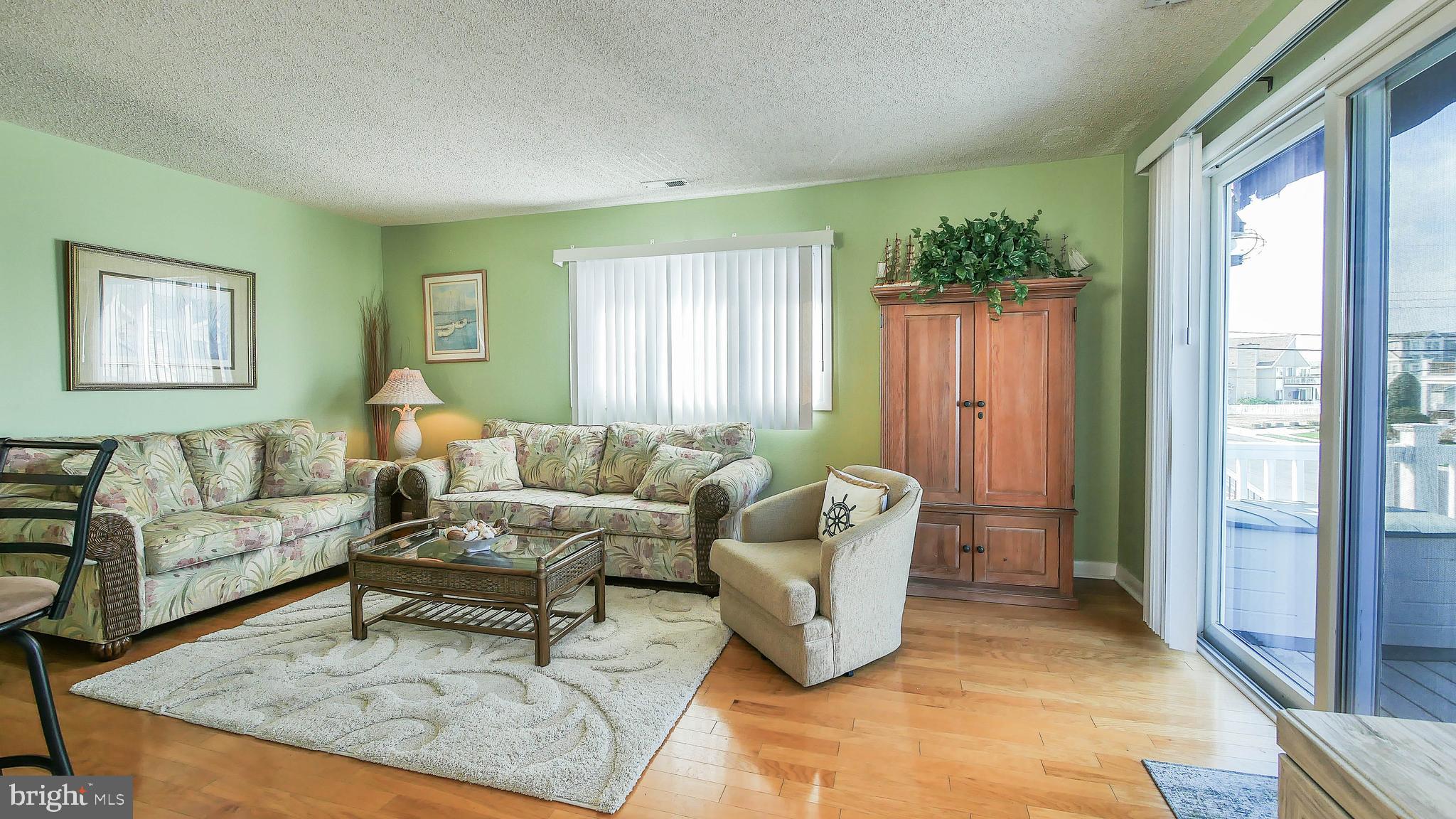 4025 4th Avenue Avalon, NJ 08202 - Photo 22 of 32 a living room with furniture and a large window