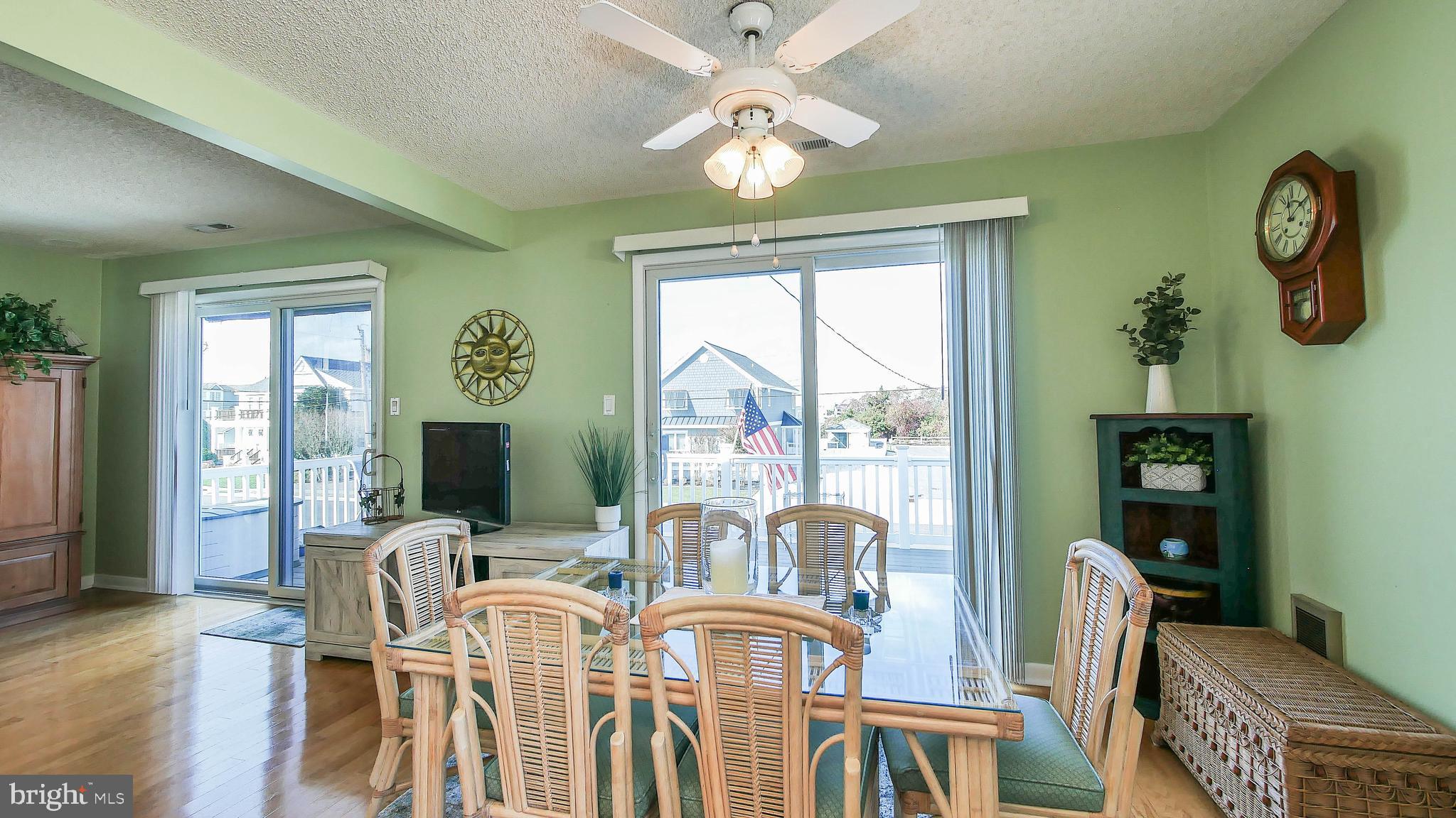 4025 4th Avenue Avalon, NJ 08202 - Photo 29 of 32 a view of a dining room with furniture window and wooden floor