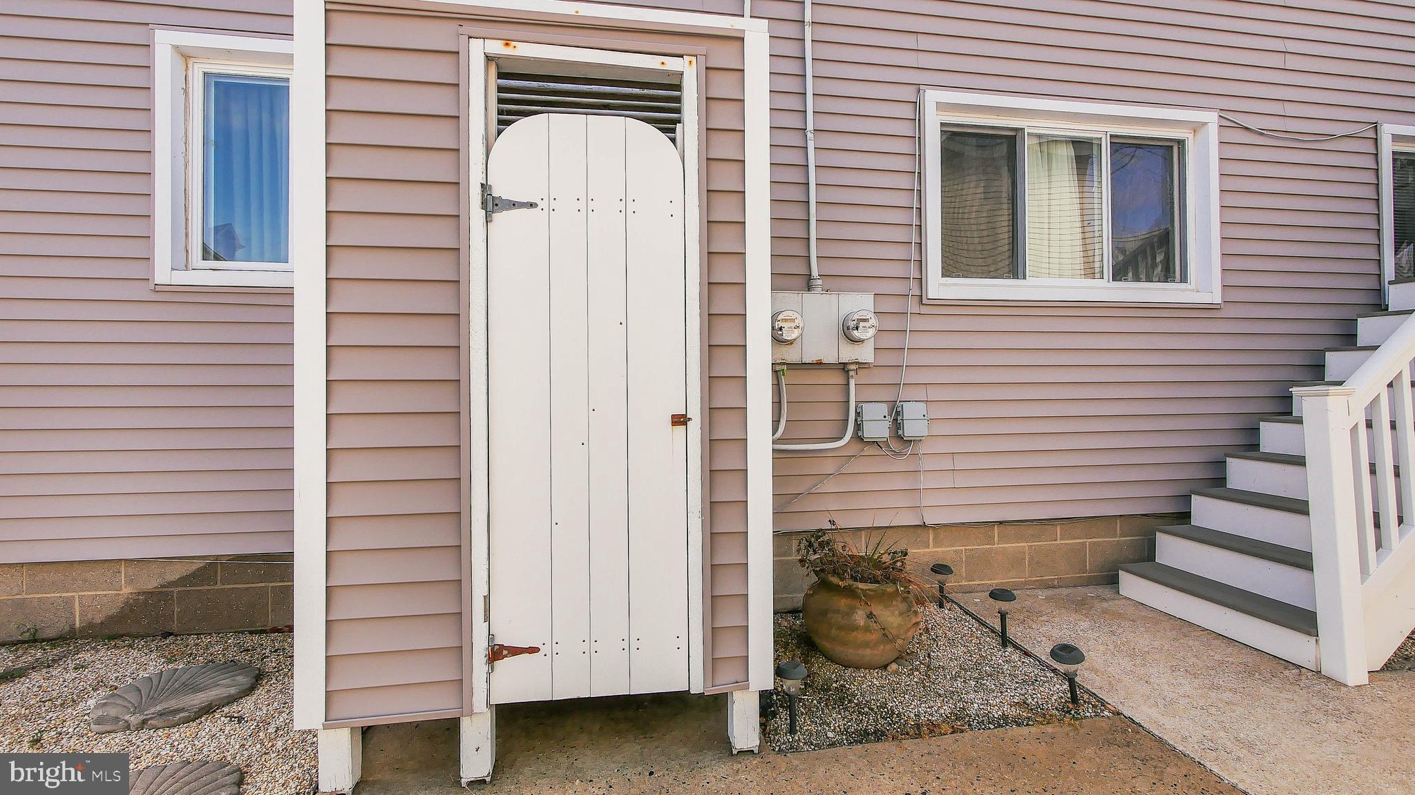 4025 4th Avenue Avalon, NJ 08202 - Photo 5 of 32 a front view of a house with stairs