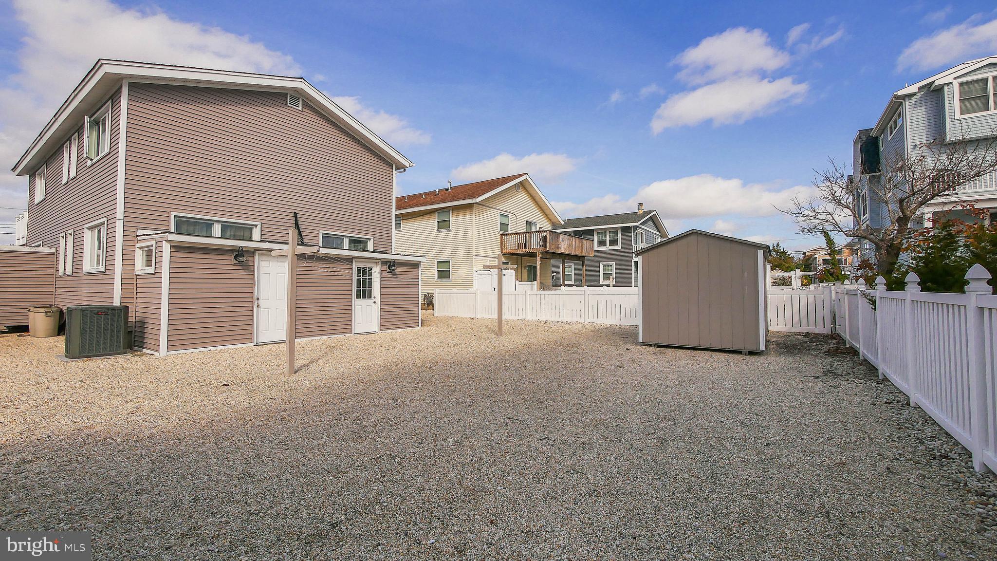 4025 4th Avenue Avalon, NJ 08202 - Photo 6 of 32 a view of a house with a backyard