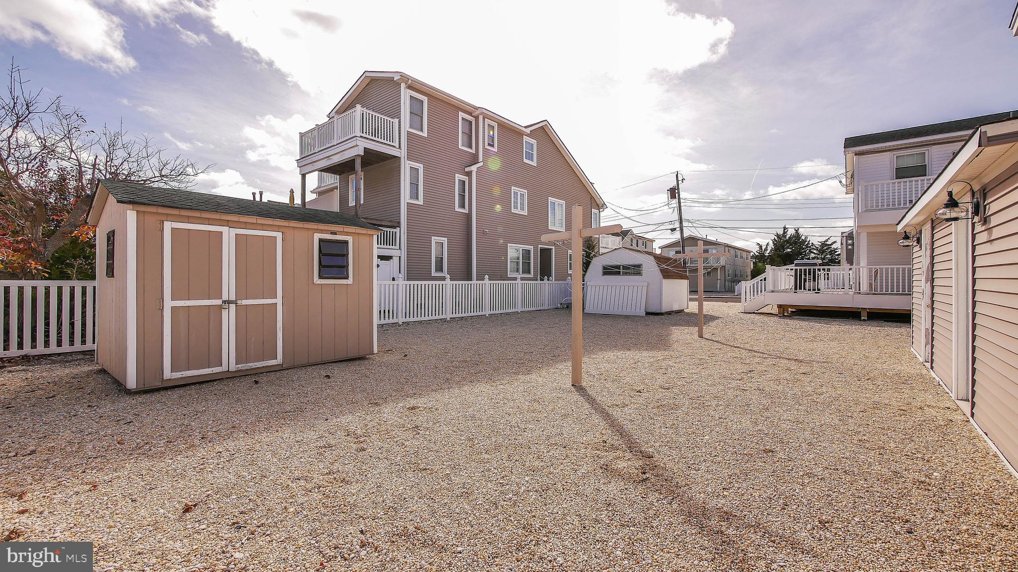 4025 4th Avenue Avalon, NJ 08202 - Photo 8 of 32 a view of a car park in front of house