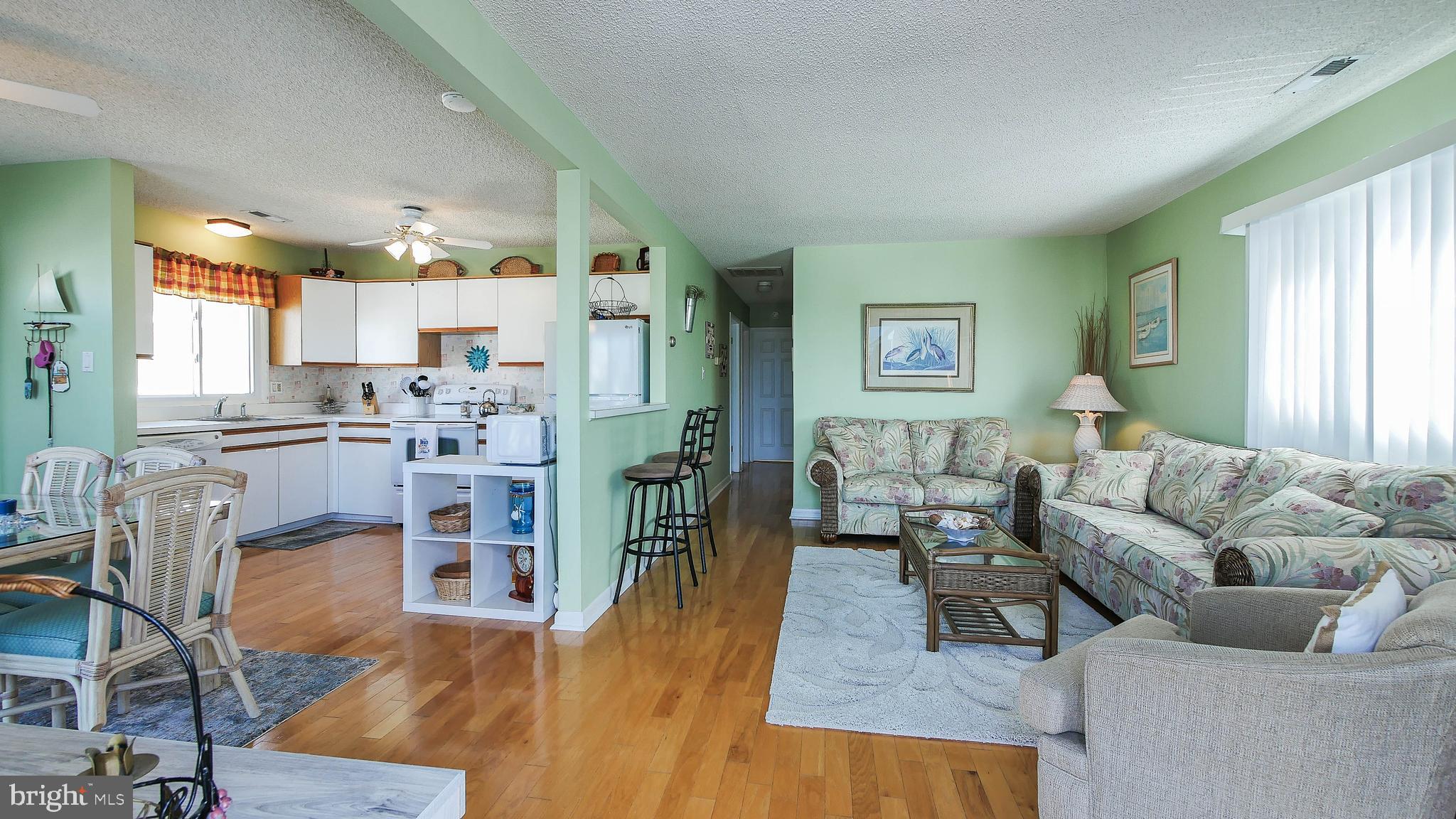 4025 4th Avenue Avalon, NJ 08202 - Photo 10 of 32 a living room with furniture and a wooden floor