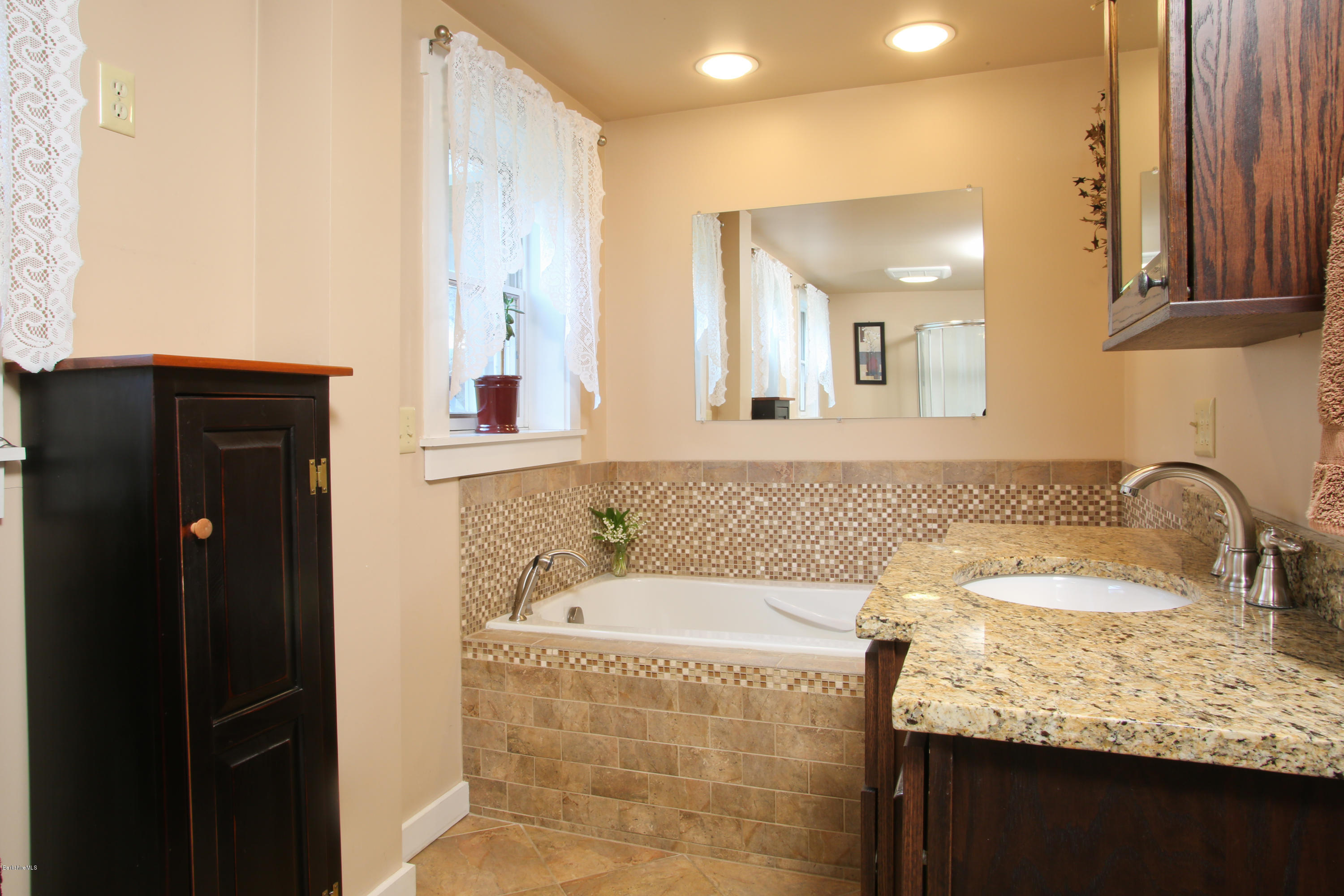 32 White Road Colrain, MA 01340 - Photo 18 of 34 a bathroom with a granite countertop sink and a mirror