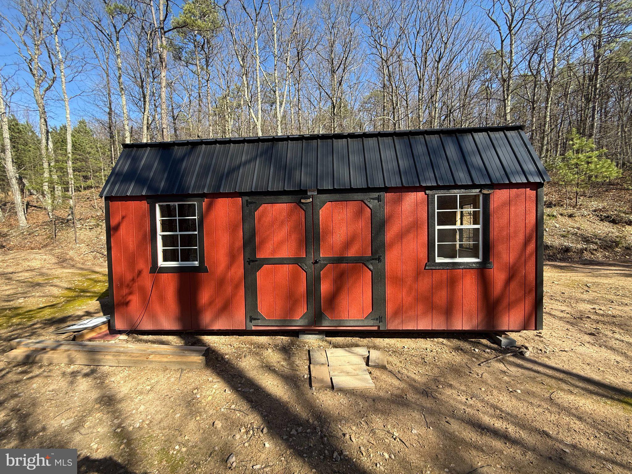Advent Drive Augusta, WV 26704 - Photo 53 of 65 Charming red shed nestled in nature.
