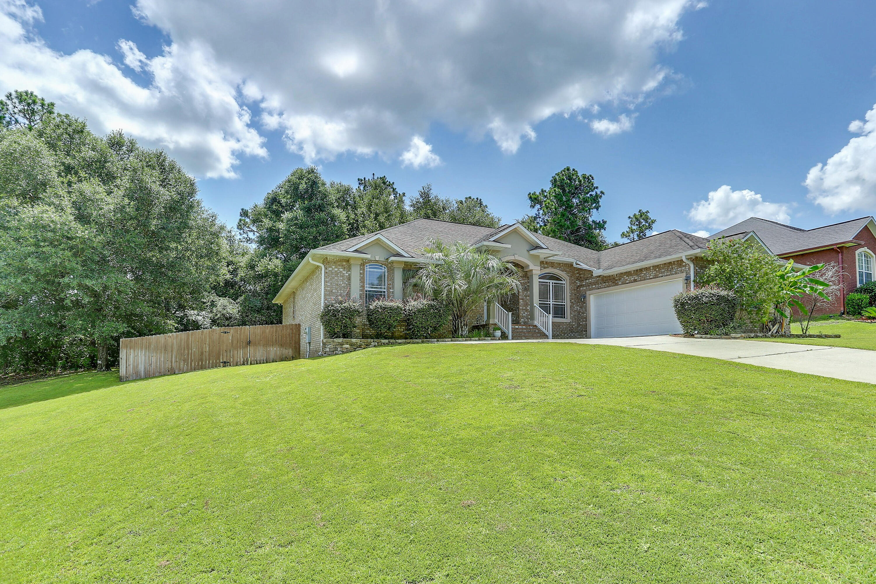 202 Pinque Coat Court Crestview, FL 32536 - Photo 1 of 35 a front view of house with yard and green space