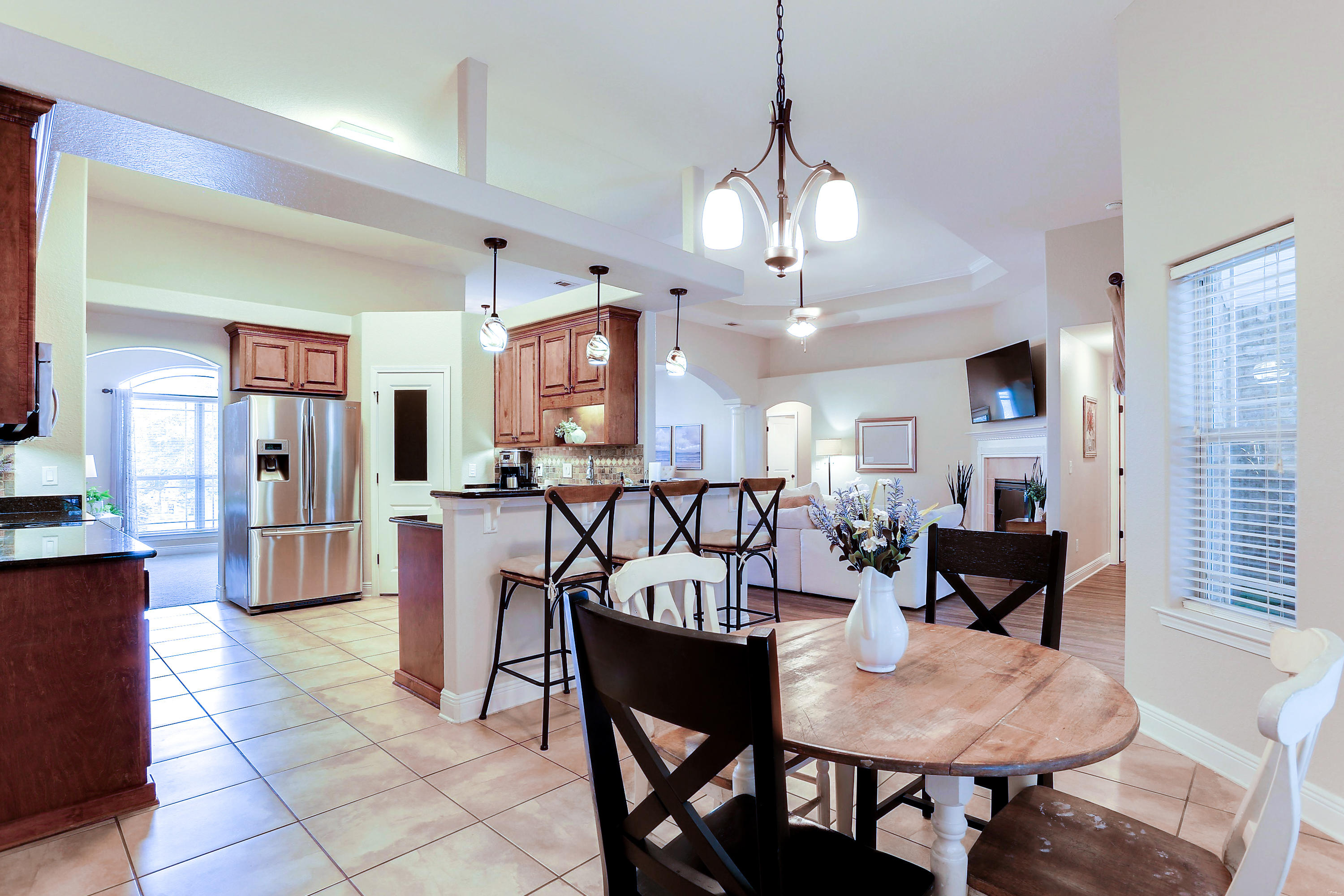 202 Pinque Coat Court Crestview, FL 32536 - Photo 16 of 35 a view of a dining room with furniture and wooden floor