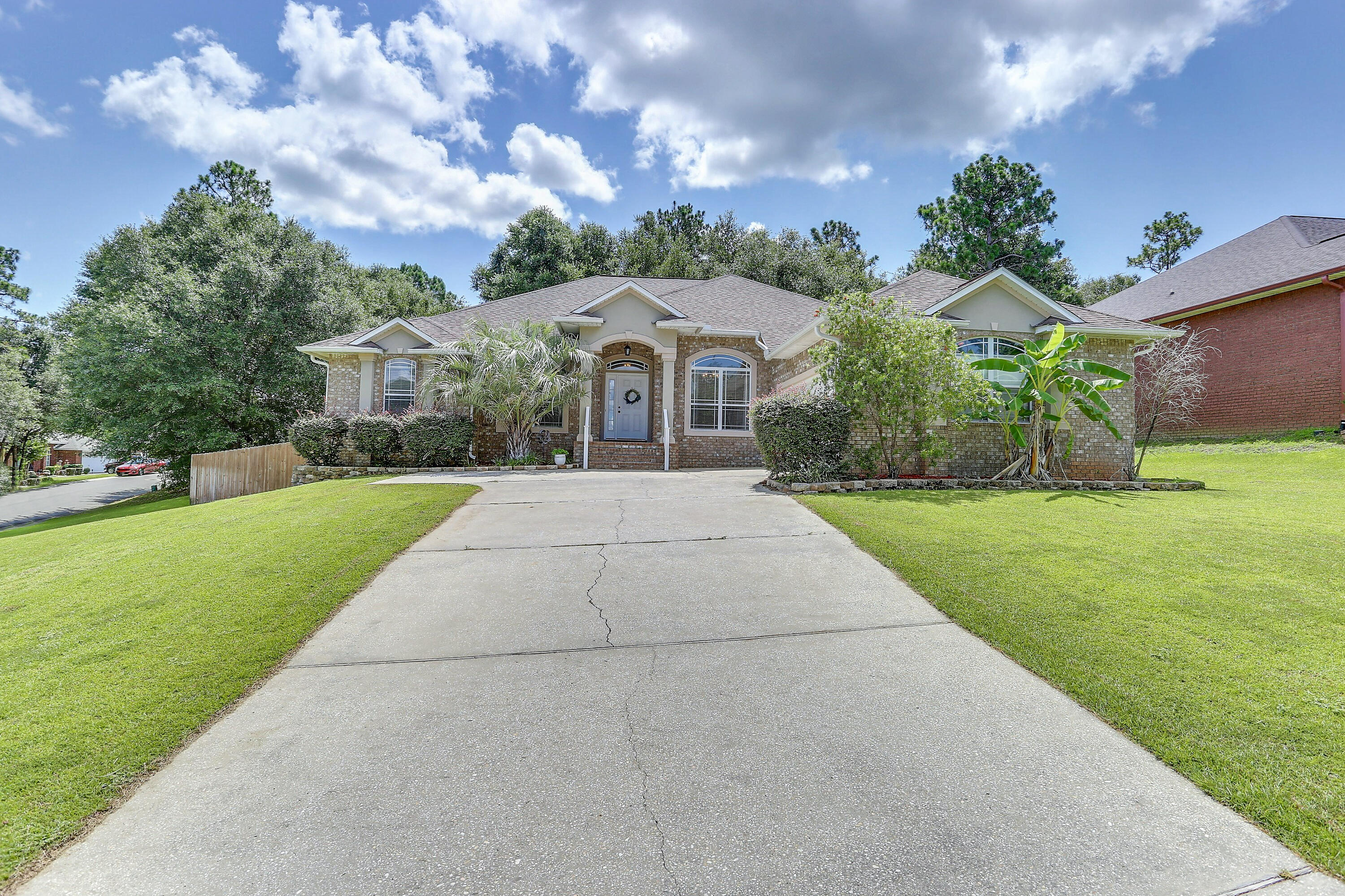 202 Pinque Coat Court Crestview, FL 32536 - Photo 3 of 35 a front view of a house with a yard