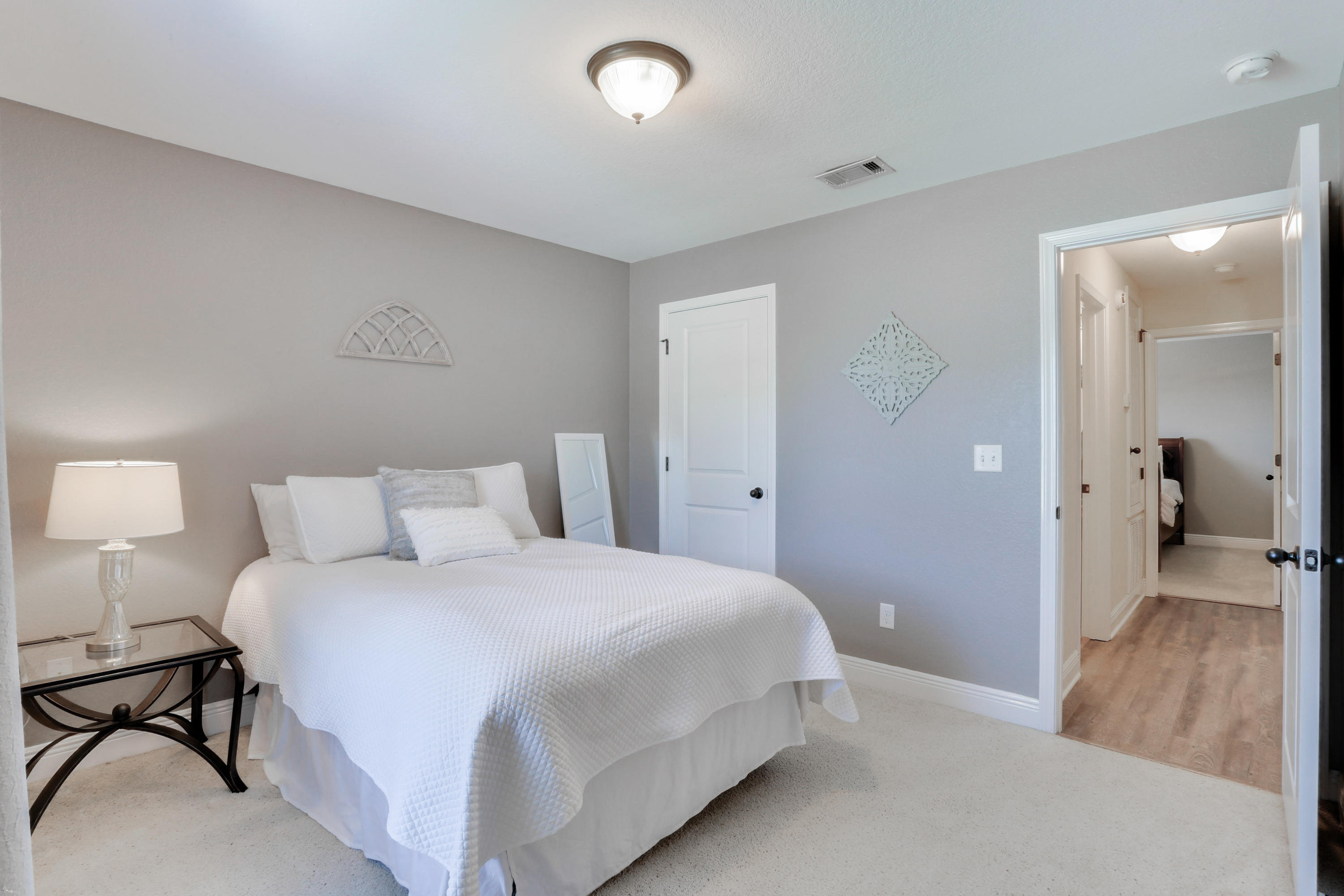 202 Pinque Coat Court Crestview, FL 32536 - Photo 24 of 35 a bedroom with a bed and a table