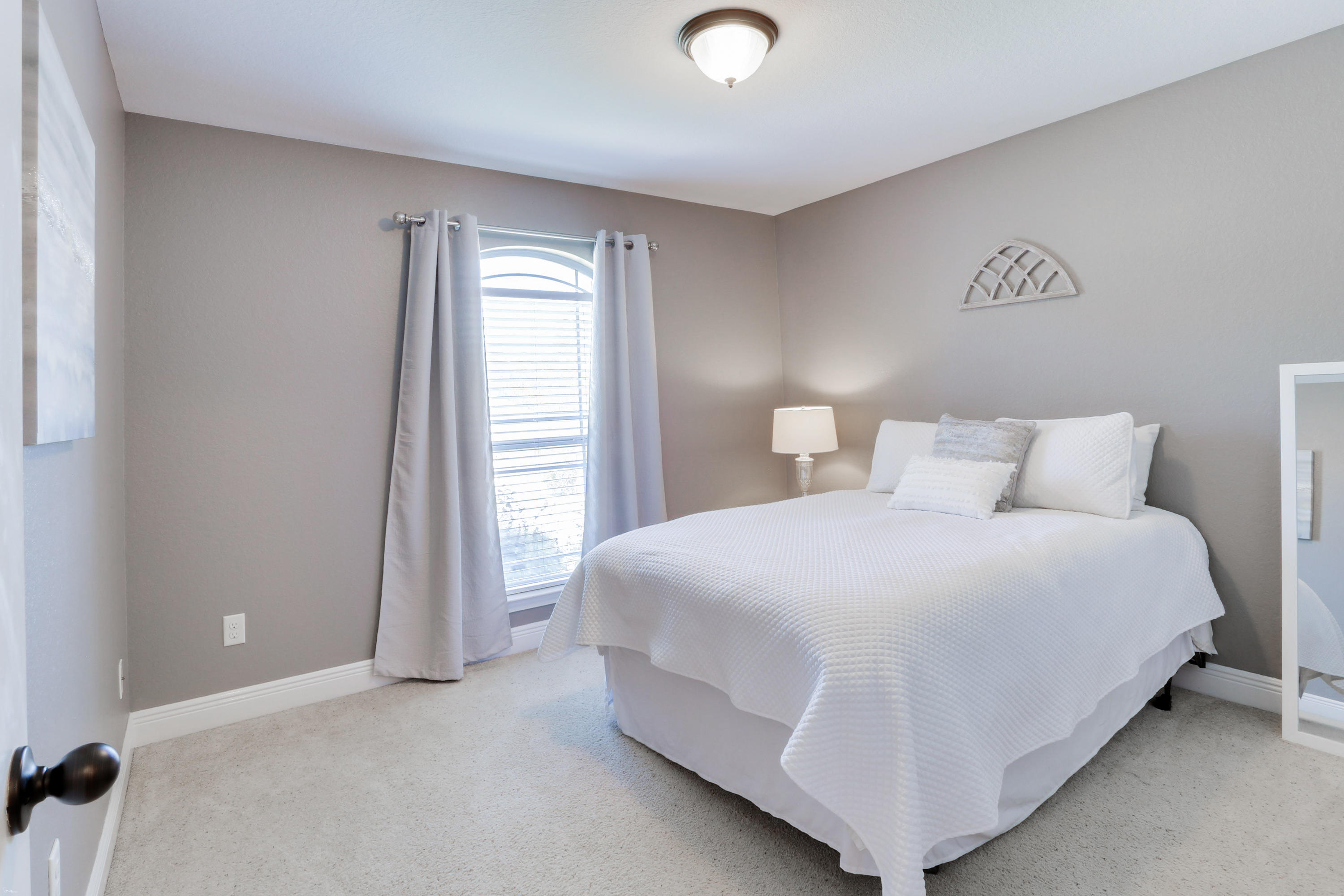 202 Pinque Coat Court Crestview, FL 32536 - Photo 25 of 35 a bedroom with a bed and a window