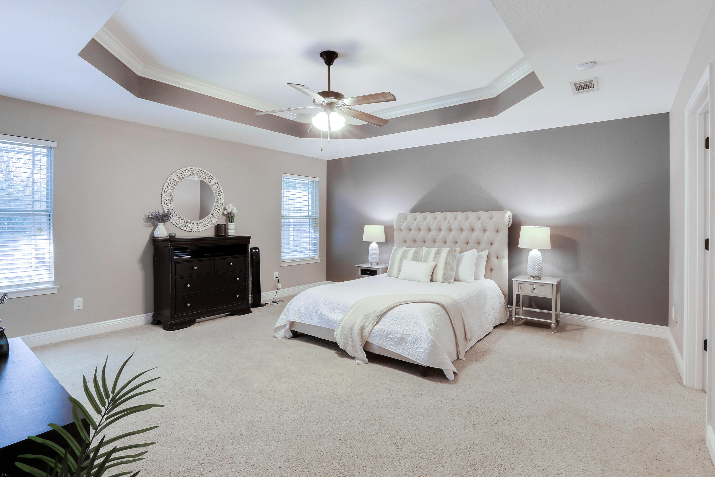 202 Pinque Coat Court Crestview, FL 32536 - Photo 26 of 35 a bedroom with a bed and a chandelier
