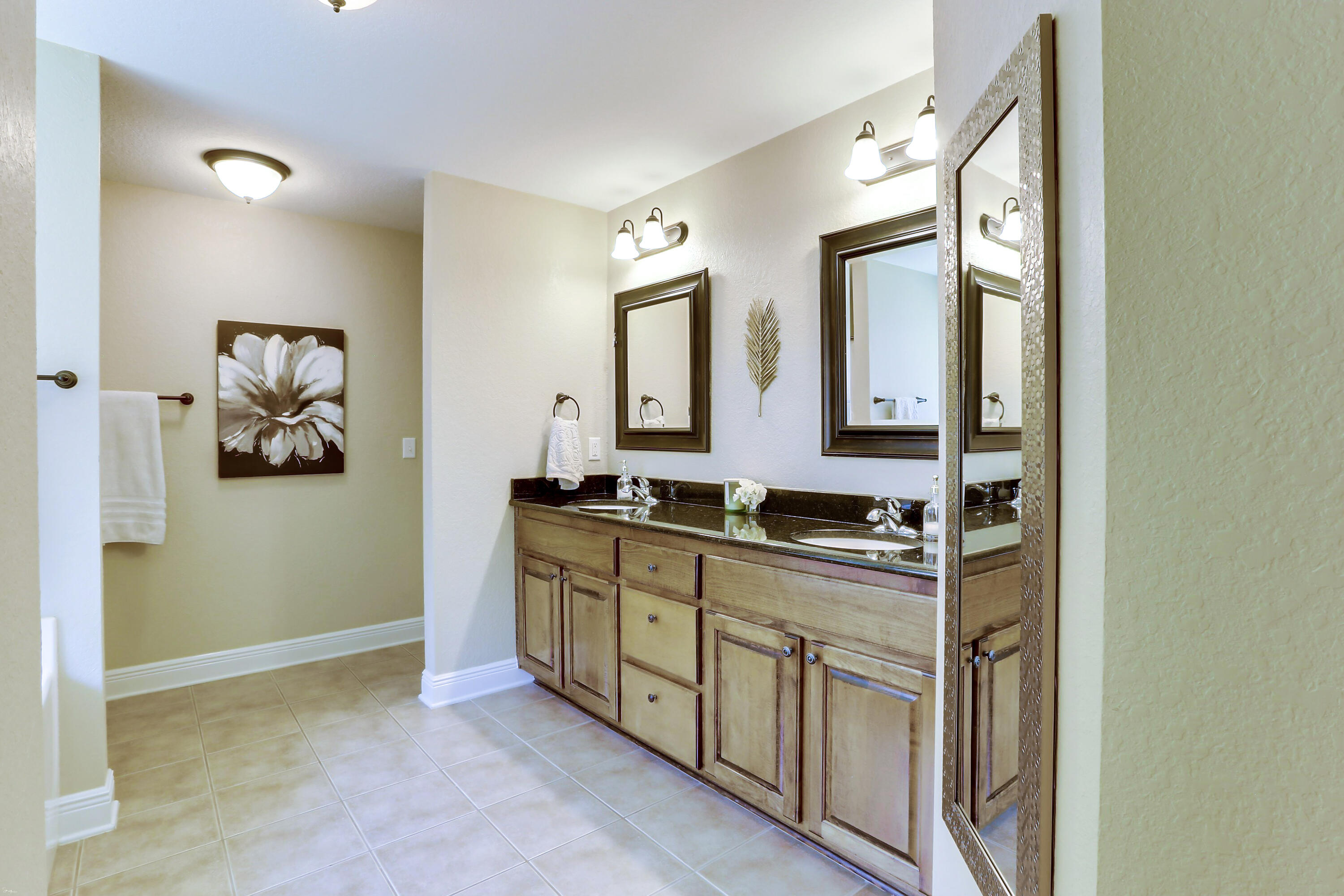 202 Pinque Coat Court Crestview, FL 32536 - Photo 28 of 35 a bathroom with a double vanity sink and mirror