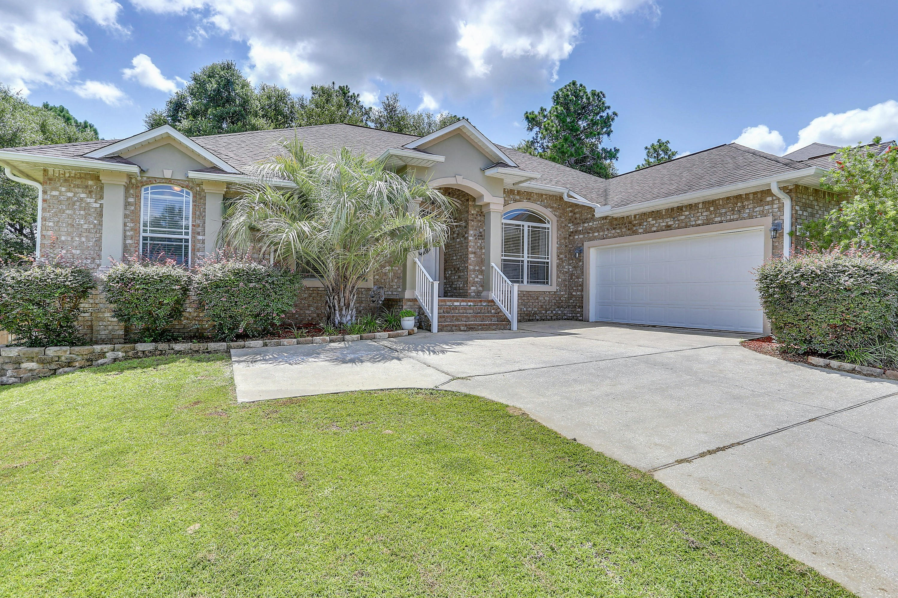 202 Pinque Coat Court Crestview, FL 32536 - Photo 4 of 35 a front view of a house with a yard and garage