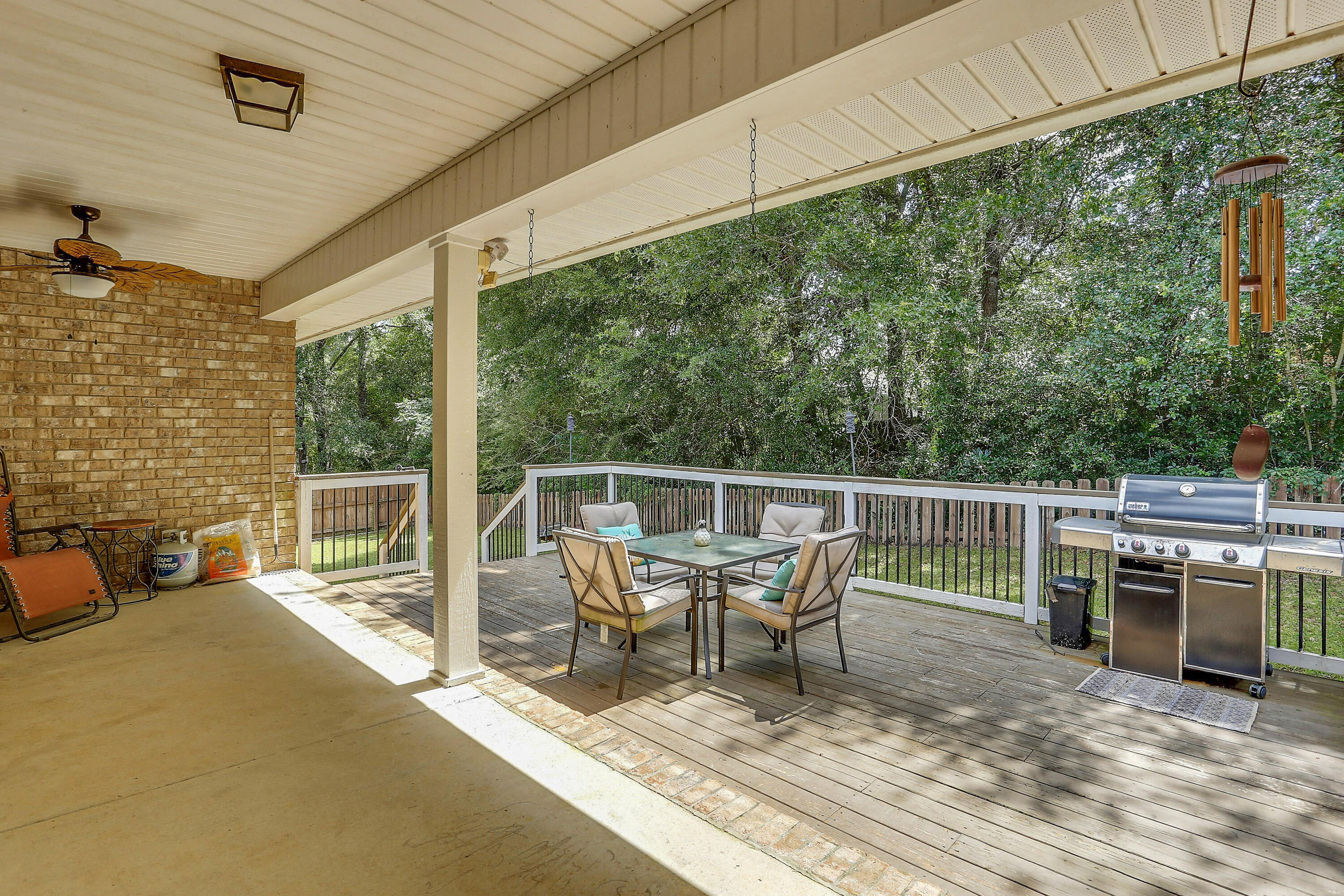 202 Pinque Coat Court Crestview, FL 32536 - Photo 32 of 35 a view of a patio with a table chairs and wooden floor