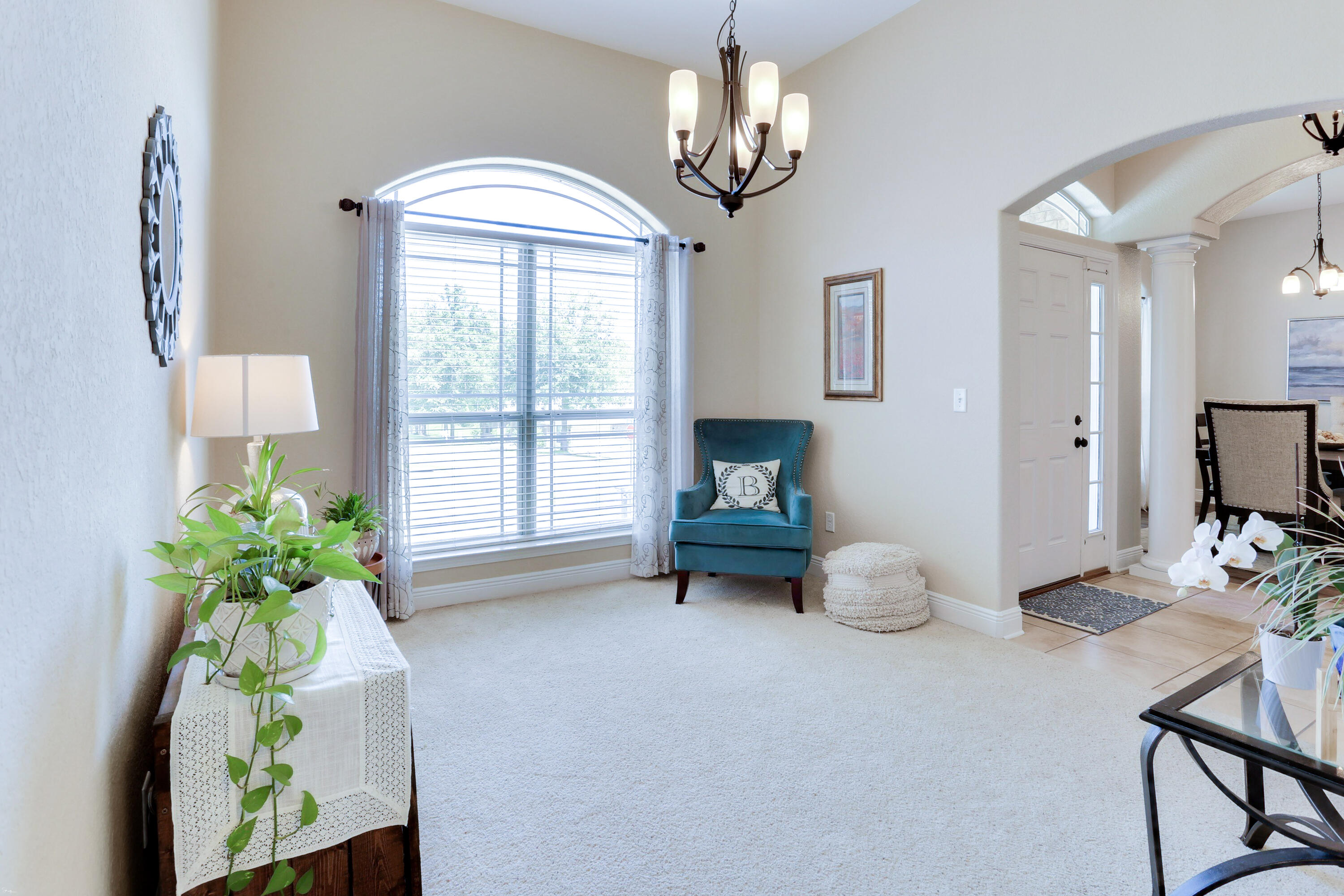 202 Pinque Coat Court Crestview, FL 32536 - Photo 7 of 35 a living room with furniture and a chandelier