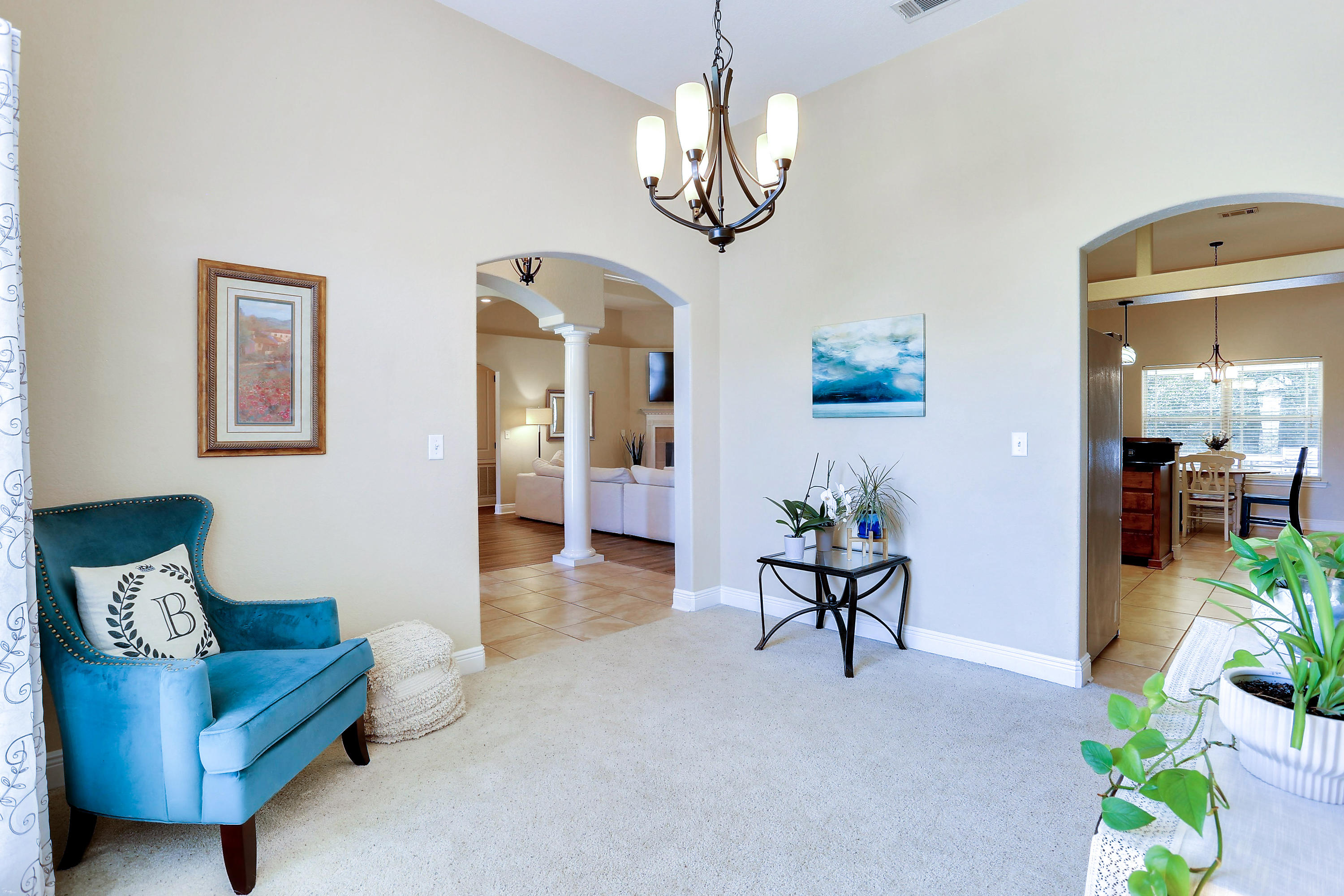 202 Pinque Coat Court Crestview, FL 32536 - Photo 8 of 35 a living room with furniture and a chandelier