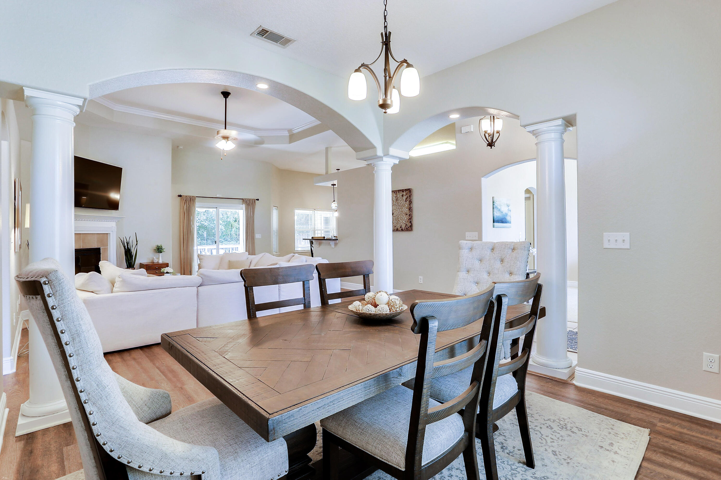 202 Pinque Coat Court Crestview, FL 32536 - Photo 10 of 35 a view of a dining room with furniture and wooden floor