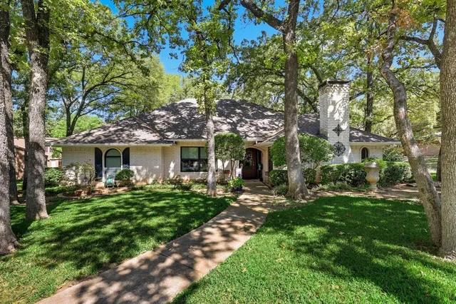a front view of house with yard outdoor seating and green space
