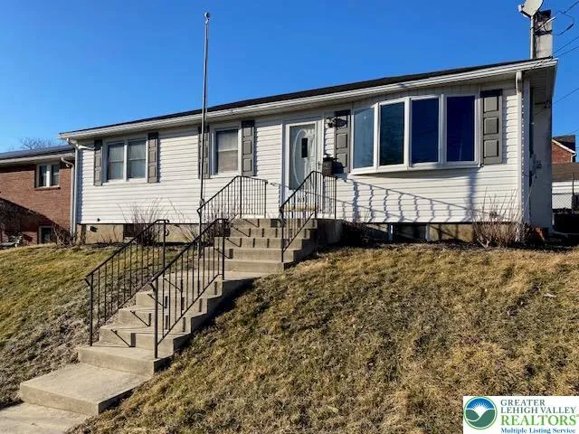 front view of a house with a small yard