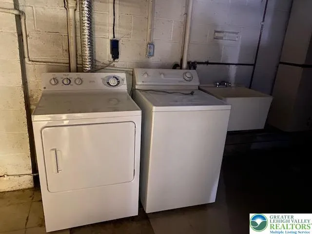 a utility room with dryer and washer