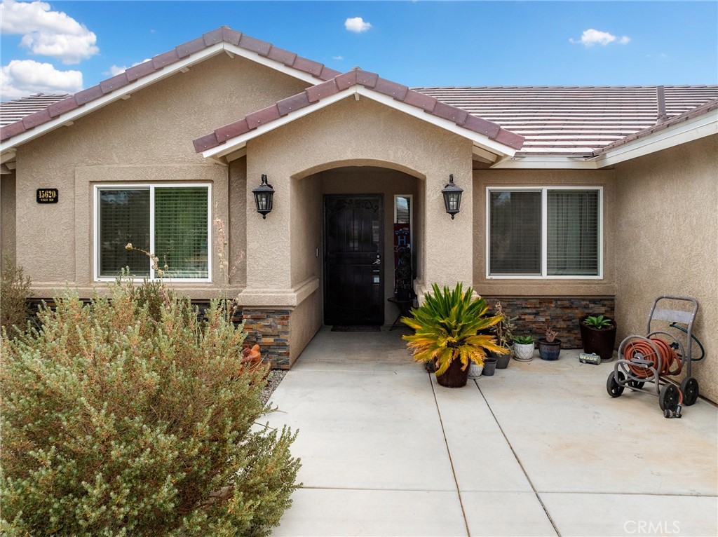 15620 Erie Road Apple Valley, CA 92307 - Photo 2 of 53 a front view of house with a outdoor seating