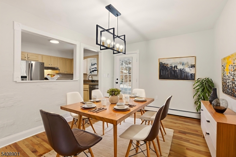 510 Davsel Road Landing, NJ 07850 - Photo 13 of 25 a view of a dining room with furniture wooden floor and a chandelier