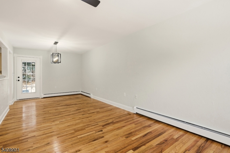 510 Davsel Road Landing, NJ 07850 - Photo 15 of 25 a view of an empty room with wooden floor and a window