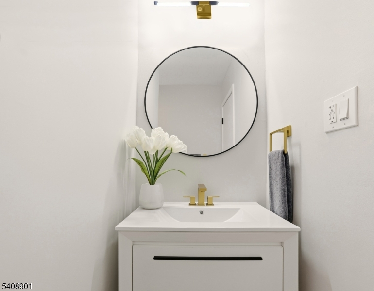 510 Davsel Road Landing, NJ 07850 - Photo 16 of 25 a bathroom with a sink a vanity and a mirror
