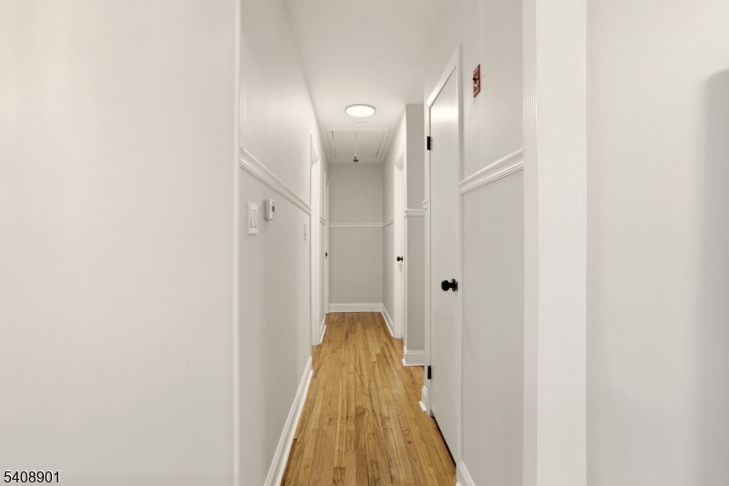 510 Davsel Road Landing, NJ 07850 - Photo 21 of 25 a view of a hallway with wooden floor and staircase