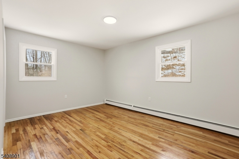 510 Davsel Road Landing, NJ 07850 - Photo 24 of 25 a view of an empty room with wooden floor and a window
