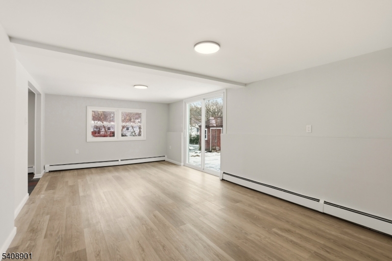 510 Davsel Road Landing, NJ 07850 - Photo 6 of 25 an empty room with wooden floor and windows
