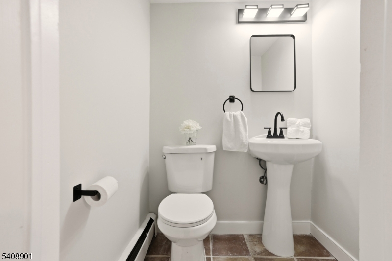 510 Davsel Road Landing, NJ 07850 - Photo 8 of 25 a bathroom with a toilet sink and mirror