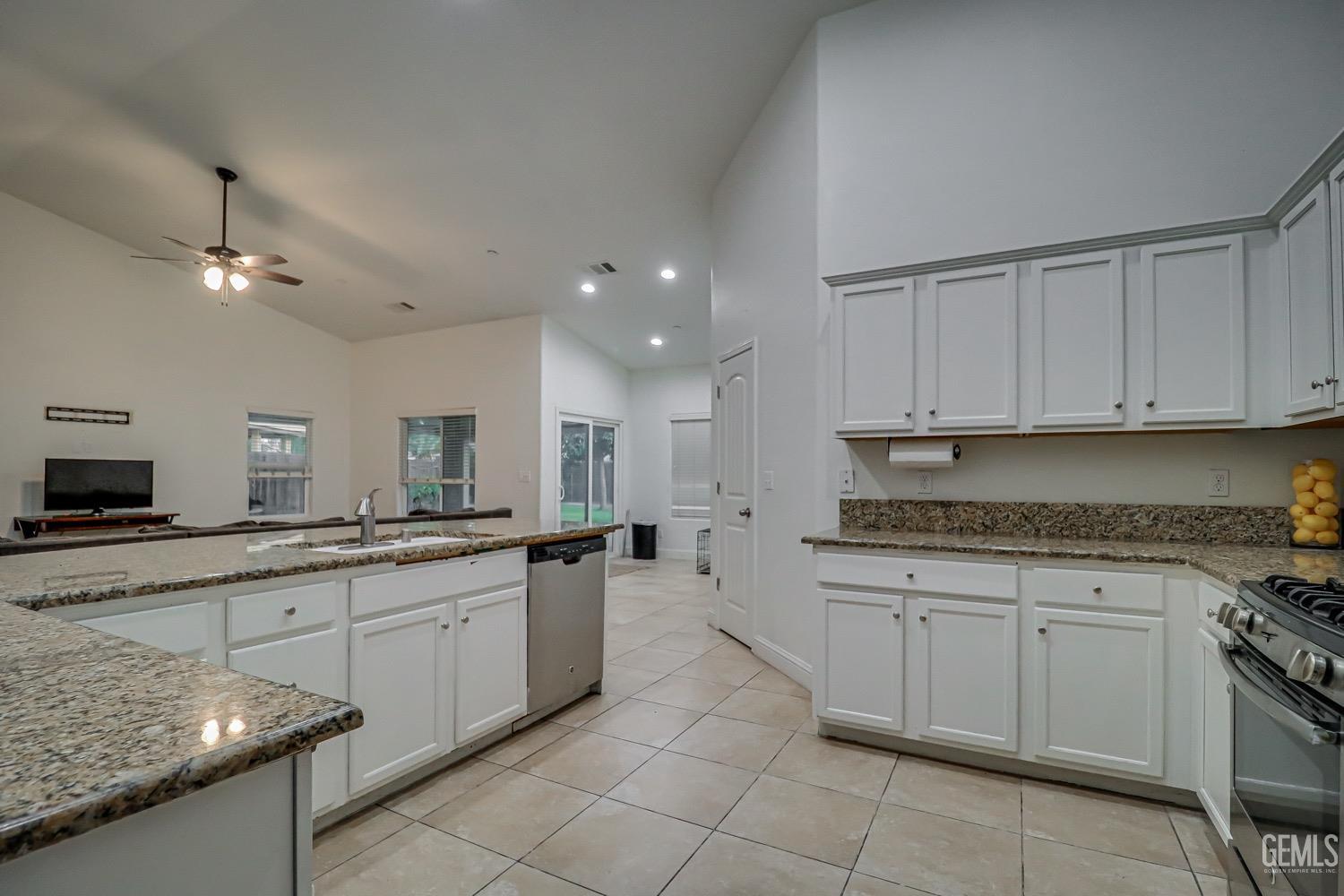 Undisclosed Address Bakersfield, CA 93313 - Photo 12 of 25 a kitchen with a sink and cabinets