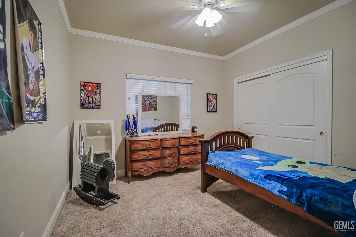 Undisclosed Address Bakersfield, CA 93313 - Photo 15 of 25 a bedroom with furniture and a chandelier fan