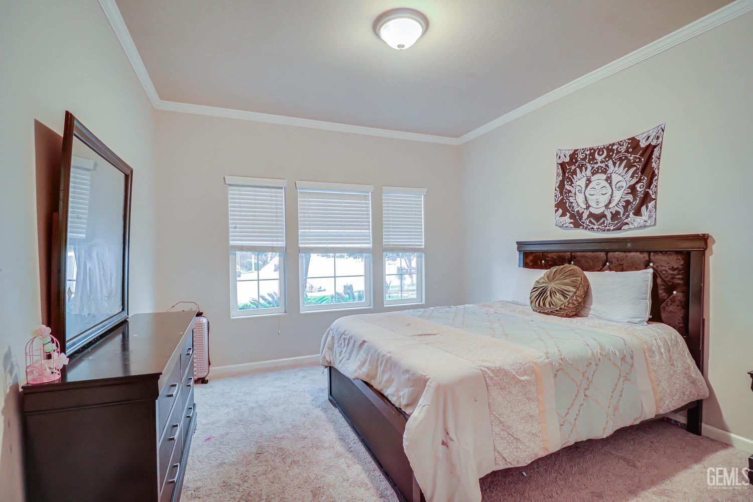 Undisclosed Address Bakersfield, CA 93313 - Photo 16 of 25 a bedroom with a large bed and window