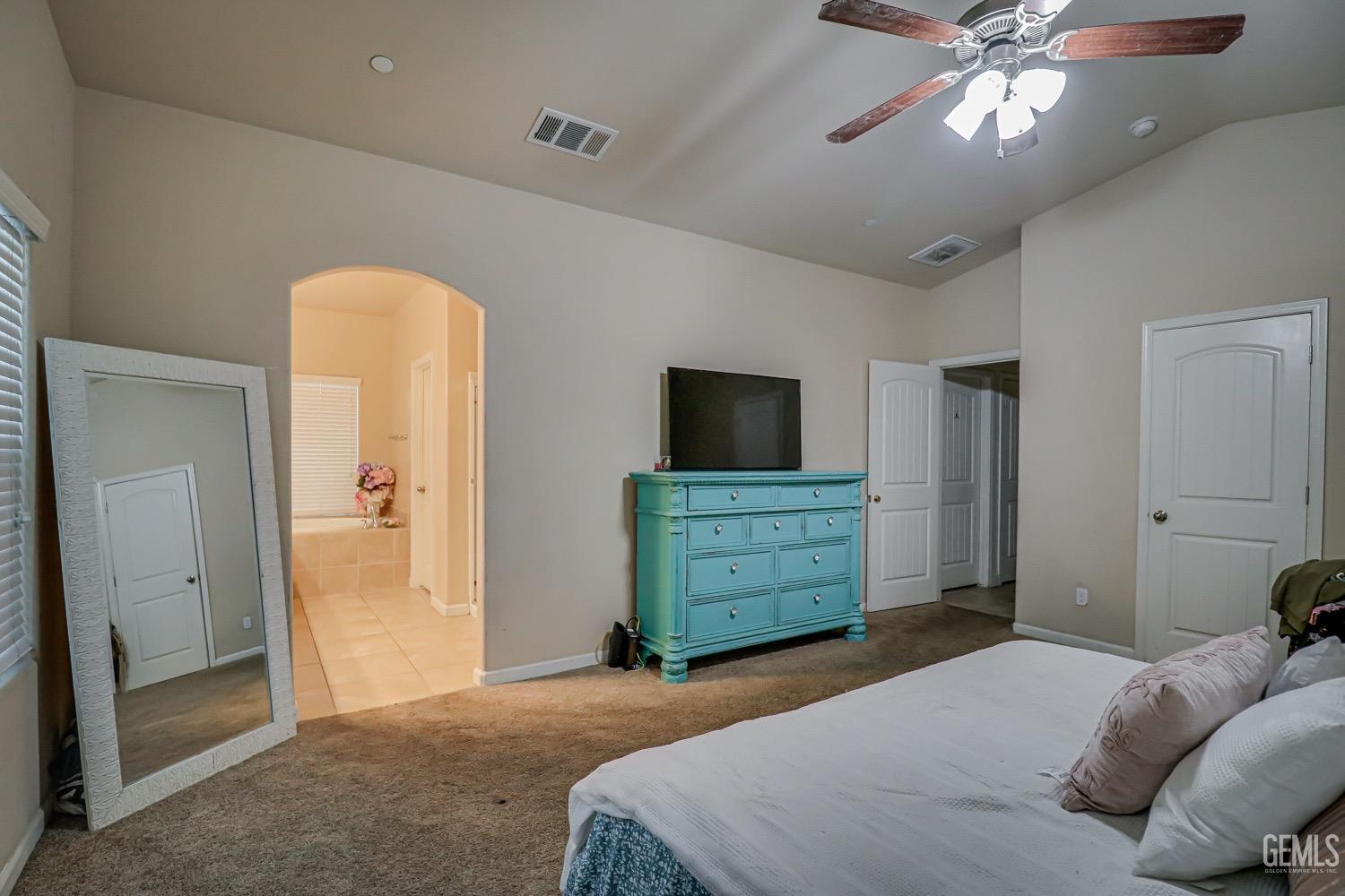 Undisclosed Address Bakersfield, CA 93313 - Photo 19 of 25 a bedroom with a bed and a tv