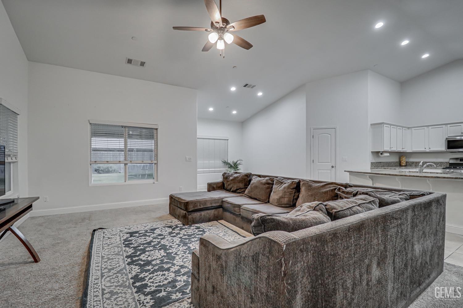 Undisclosed Address Bakersfield, CA 93313 - Photo 10 of 25 a living room with furniture and kitchen view