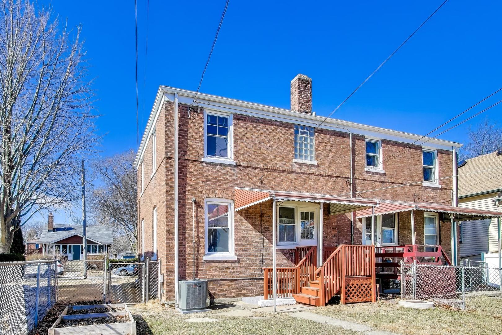4023 Oak Avenue Brookfield, IL 60513 - Photo 15 of 17 a front view of a building with many windows